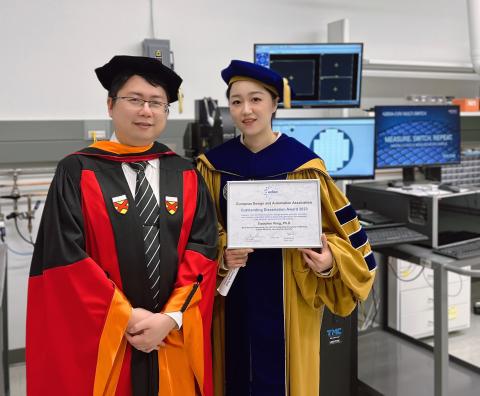 Peng and Yu in the research lab before the 2023 Spring Georgia Tech Commencement where Peng received her Ph.D. Peng is holding the EDAA’s Outstanding Dissertation Award for her NeuroSim series work.