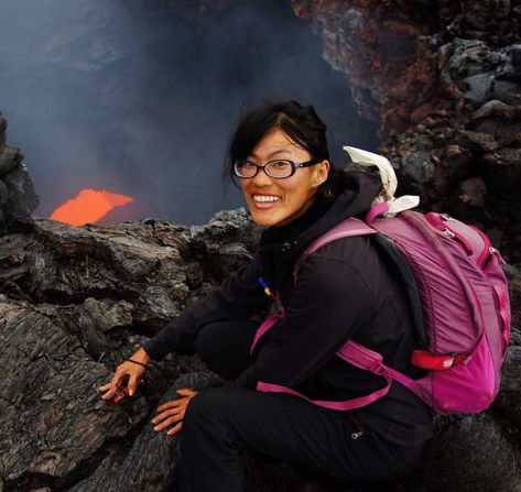 Photo of Dr. Shi "Joyce" Sim near a volcano