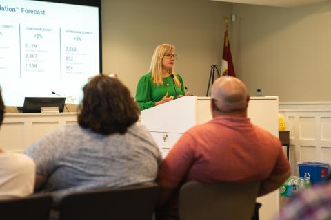 This picture shows Betsy McGriff of Georgia Tech's Center for Economic Development Research speaking to residents in Pembroke, Georgia, about expected housing growth due to the nearby Hyundai auto plant