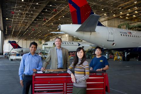 Jose Sarmiento, ISyE undergraduate student; Prof. Anton Kleywegt; Kyungha Lim, ISyE undergraduate student; & Xinchang Wang, ISyE PhD student, plying the tools of the trade at Delta's Tech Ops Center.