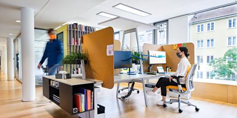 A furnished office environment with furniture designed by Steelcase.