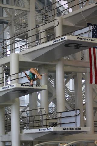 Diver on one of the platform boards at the McAuley Aquatic Center