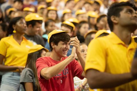 A student dons his RAT cap at New Student Convocation in Fall 2019