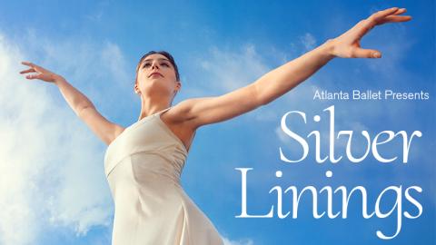Atlanta Ballet presents Silver Linings. Atlanta Ballet dancer Emma Guertin wears a white leotard with skirt. Her bare arms are outstretched.  Her arms are raised, and she is set against a deep blue sky.