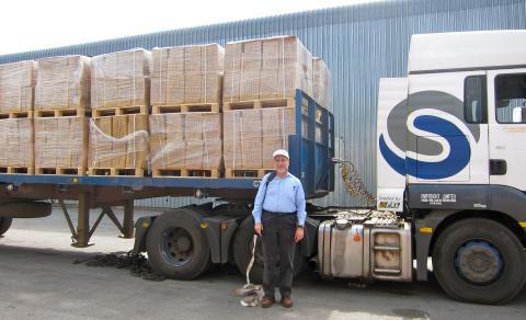 John Bartholdi in front of a UNICEF truck in Zimbabwe carrying textbooks for distribution to schools throughout the country.
