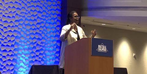 A photo of Kaye Husbands Fealing, chair of the School of Public Policy, speaking at the 2018 NASPAA conference