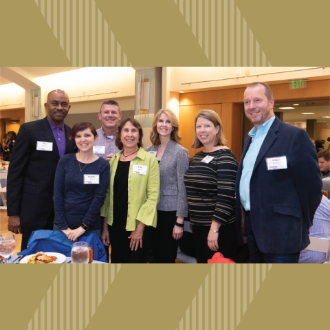 ISyE Academic Advisor Fran Buser (in green jacket) with colleauges at the 2019 Faculty & Staff Honors Luncheon: Ron Johnson, Brandy Blake, Jon Lowe, Carole Bennett, Dawn Strickland, and School Chair Edwin Romeijn