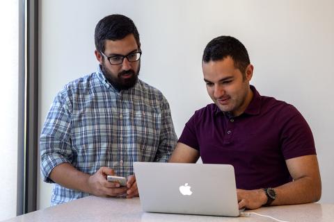 Fikret Atalay and Mahdi Roozbahani working side by side at a computer