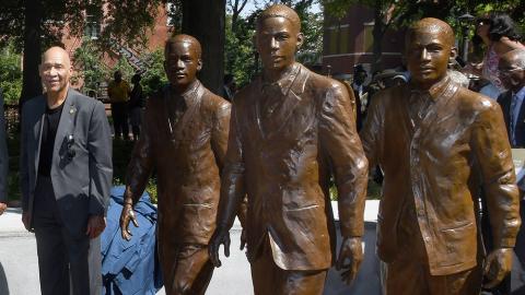 Ford Greene stands next to the set of statues honoring him and the other two African American men who integrated Georgia Tech in 1961. The statues were unveiled at a ceremony in September 2019. (Photo: Christopher Moore)