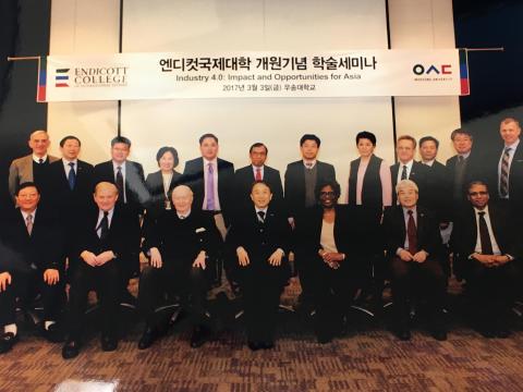 Attendees of the Endicott College of International Studies naming event included JR Reagan (back row, far right), vice dean of Endicott College; and Kim Sung-kyung (front row, center), chairman of Woosong University. 