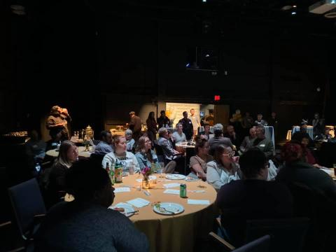A photo of LMC Alumnx Bash attendees listening to Chaird Richard Utz.