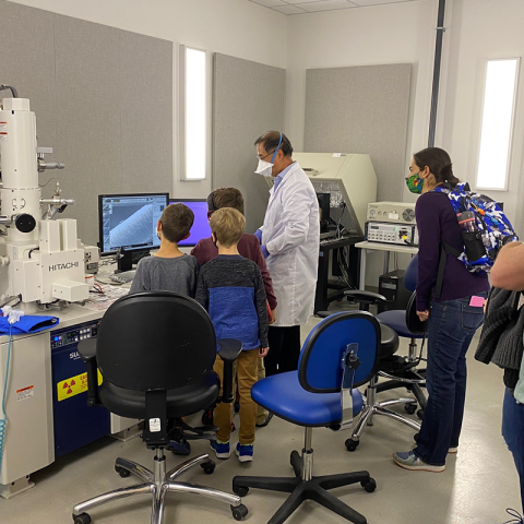 Staff Scientist Tim Zhang of the GT Materials Characterization Facility wows visitors with the micro-scale features of a strand of hair during the Atlanta Science Festival's GT Science and Engineering Day.