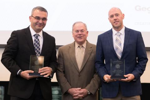 photograph of ECE Assistant Professor Manos Antonakakis and Chief Strategist GTRI CIPHER Laboratory Michael Farrell with Executive Vice President for Research Steve Cross