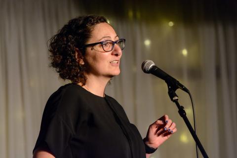 Meltem Alemdar shares her story with the Story Collider at the Highline Inn and Ballroom in Atlanta, GA in January 2019. Photo by Rob Felt.