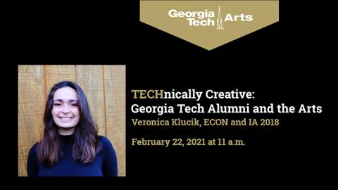Technically Creative: Georgia Tech Alumni and the Arts with Veronica Klucik, Monday, February 22, 2021 at 11 a.m. on Georgia Tech Arts Facebook Live page. A woman with dark hair, parted in the middle and falling past her shoulders, smiles at the camera. She is wearing a dark blue turtleneck sweater and standing in front of a wooden wall.