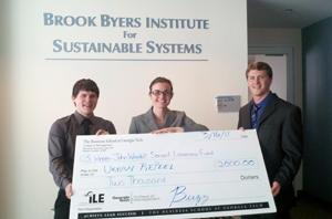 Picture of I2S 2011 winning team, Urban RePeel with award check.
