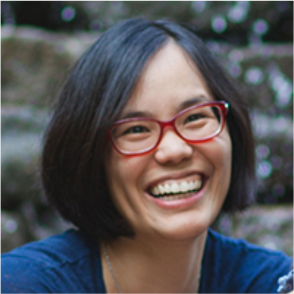 Photo of Wendy Fu, a woman in red glasses smiling at the camera.