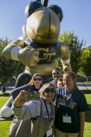 photo of family in front of inflatable Buzz