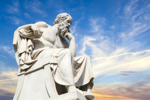 A statue of Socrates with blue sky 