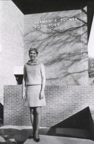 Judith Priddy, dean of women students, in front of Fulmer Hall