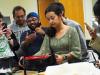 Foley Scholar Masters Student Arianna Mastali (MS-HCI) demonstrates the use of the Craft Lab knitting machine. 