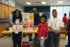 students posing next to their invention at k-12 InVenture Prize