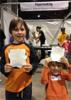Gavin and Liam Englehardt display their handsheets from the Festival