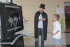 Faculty member, Garrett Stanley, PhD, gives "magical" scientific demonstration to curious visitor