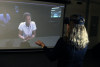 Maribeth Gandy, director of the Interactive Media Technology Center and Wearable Computing Center, demonstrates augmented reality experience for social psychology research