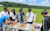 Students from the Energy Unplugged Savannah camp conduct experiments with solar panels.