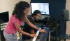 Students collaborating with music technology