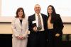 photograph of Robert Butera receiving the ANAK Award from Lynn Durham (L) and Andrea Vargas (R)