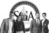 Pooja and Haigh (left) and Narayan and Aroua (right) in front of the seal of the Student Government Association