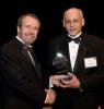 Dean Giddens (left) presents Hanif Sherali with Distinguished Engineering Alumni Award
