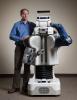Charlie Kemp poses with the robot (Photo: Rob Felt)