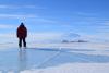 In the field: Anthony Spears stands in front of the Mount Eribus volcano and McMurdo station.