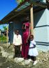 Flore Charles and her children received a Habitat for Humanity transitional shelter.
