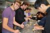 Students learning to make pasta at the CROUS cafeteria.