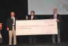 Dr. Banerjee and Dr. Hakovirta present the check to Jie Wu