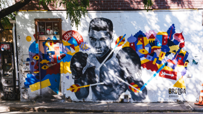 Mural of Muhammad Ali, a key figure in Smith&#039;s book turned Netflix documentary.