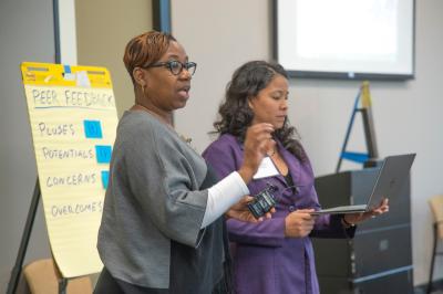 Participants give presentations at the Negotiating the Digital and Data Divide Workshop