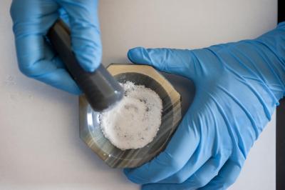 Pulverized rock in crucible
