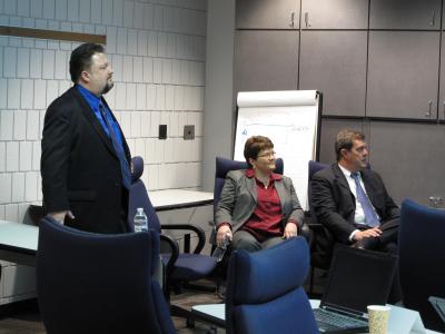 John Dunkin (left), Intel Corporation, Ellen Ewing (middle), UPS, and Michael Vance (right), Intel Corporation, present Intel-UPS global project