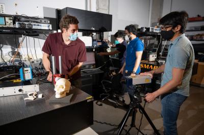 Graduate researchers measure vibration response in skull