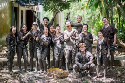 Students for ISyE and Vietnam&#039;s International University learned how to hand-catch catfish in mudbanks during a tour of the Mekong Delta. 