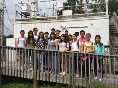 Peking University students attending the School of Earth and Atmospheric Sciences summer workshop outside an air quality monitoring site at Jefferson Street. (Photo by Renay San Miguel)