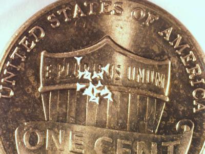 STAR particles compared to U.S. penny