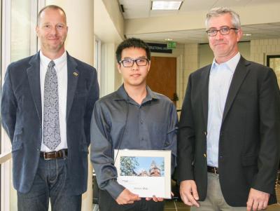 ISyE School Chair Edwin Romeijn and Associate Chair for Graduate Studies Alan Erera with Ph.D. student Simon Mak, recipient of the Alice and John Jarvis, Ph.D. Student Research Award 