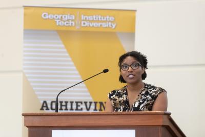 Doctoral student Toyya Pujol gives opening remarks