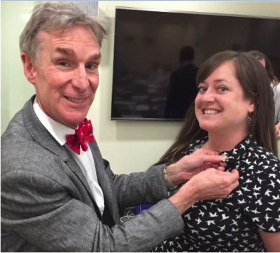 Britney Schmidt receives a pin of The Planetary Society from the CEO, currently Bill Nye, a tradition for new members of the Society’s Board of Directors. Photo courtesy of Britney Schmidt.
